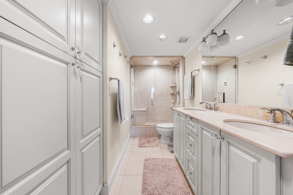 8 Museum Way, Unit 2304 Cambridge, MA 02141 - Photo 20 of 39 a bathroom with a double vanity sink mirror and toilet