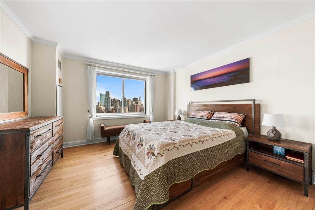 8 Museum Way, Unit 2304 Cambridge, MA 02141 - Photo 21 of 39 a bedroom with a bed and a kitchen