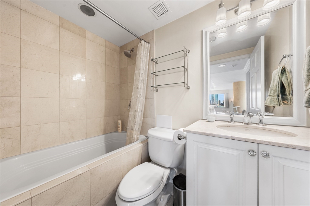 8 Museum Way, Unit 2304 Cambridge, MA 02141 - Photo 23 of 39 a bathroom with a sink a toilet and shower