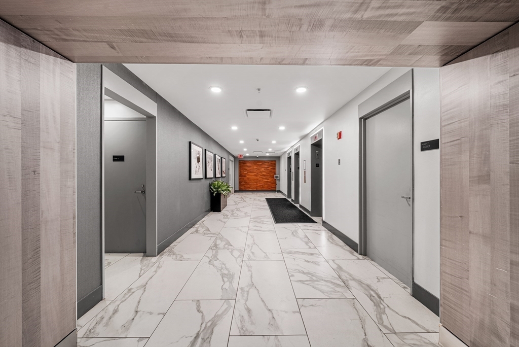 8 Museum Way, Unit 2304 Cambridge, MA 02141 - Photo 28 of 39 a spacious bathroom with a large mirror