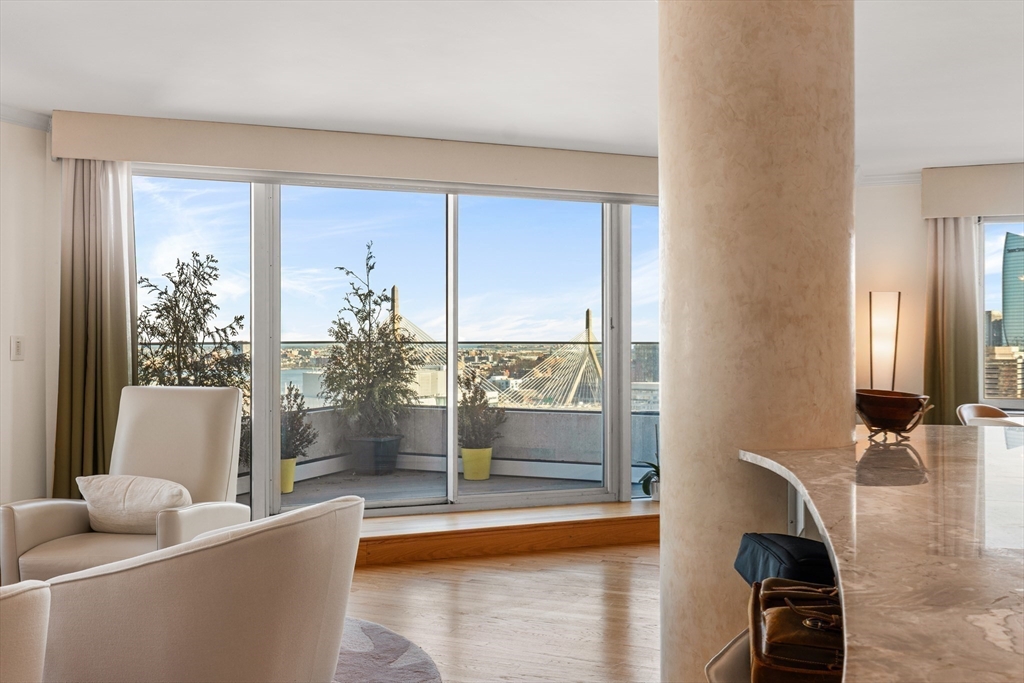 8 Museum Way, Unit 2304 Cambridge, MA 02141 - Photo 7 of 39 a living room with furniture and a large window