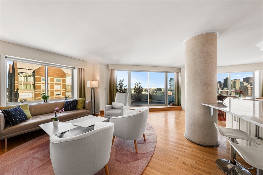 8 Museum Way, Unit 2304 Cambridge, MA 02141 - Photo 9 of 39 a living room with furniture and a wooden floor