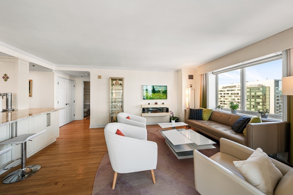 8 Museum Way, Unit 2304 Cambridge, MA 02141 - Photo 10 of 39 a living room with furniture wooden floor and a large window