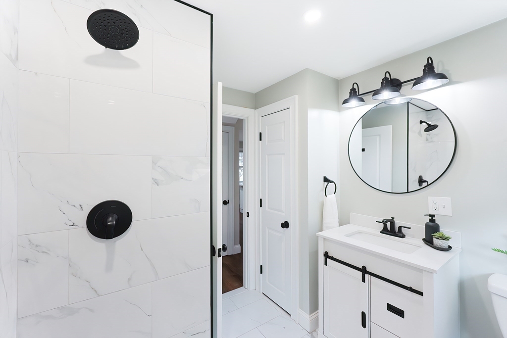 841 Lincoln Street Franklin, MA 02038 - Photo 11 of 25 a bathroom with a sink and a mirror