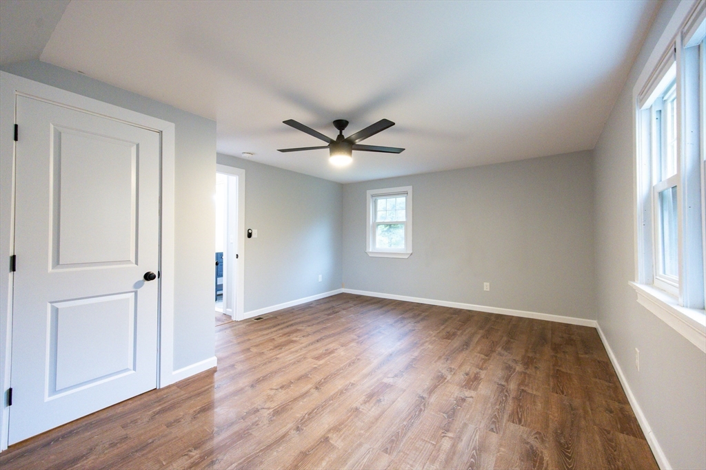 841 Lincoln Street Franklin, MA 02038 - Photo 15 of 25 an empty room with wooden floor and windows