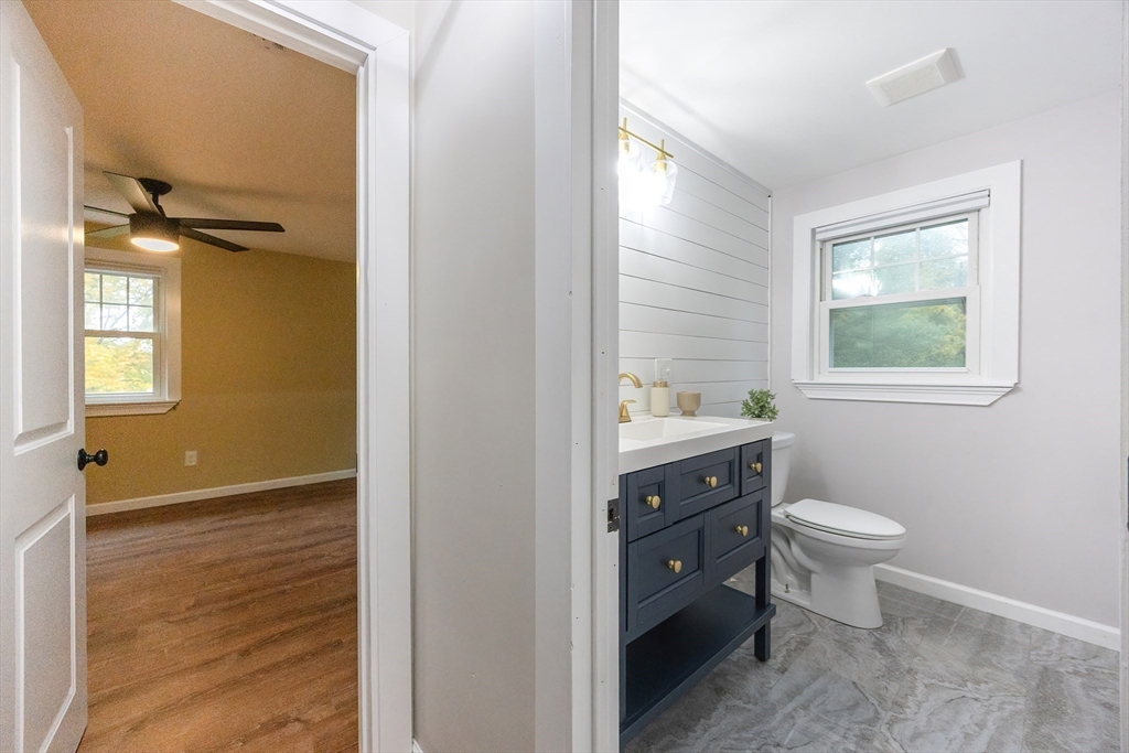 841 Lincoln Street Franklin, MA 02038 - Photo 19 of 25 a bathroom with a toilet sink and mirror