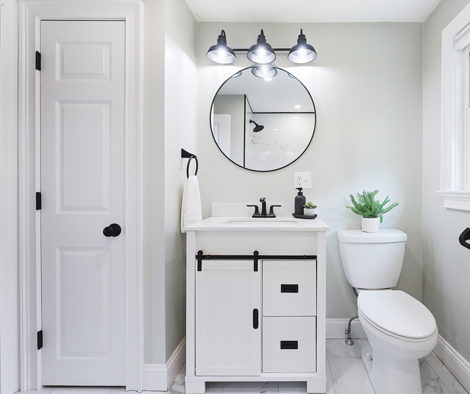 841 Lincoln Street Franklin, MA 02038 - Photo 10 of 25 a bathroom with a sink and a mirror