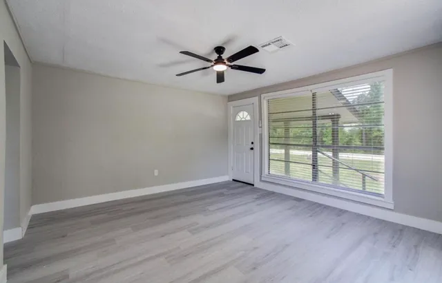 a view of an empty room with a window