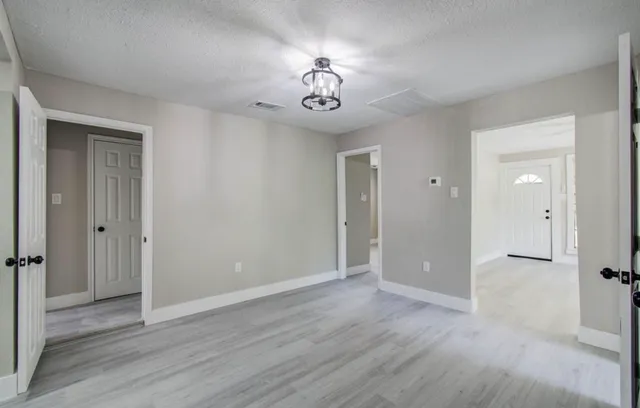 a view of an entryway with a hallway