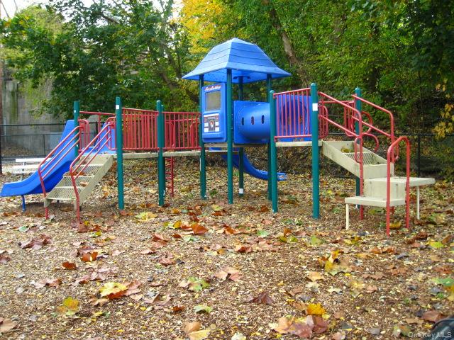 281 Garth Road, Unit B6D Scarsdale, NY 10583 - Photo 28 of 35 Garth Road Playground - Garth Road is a self contained tree lined street and 1/2 mile long starting at the Scarsdale Metro North Train Station and ending at the ball field. Easy walk to Scarsdale village and train. It's only a 33 minute train ride to Grand Central Terminal. As a resident you are entitled to join the Town’s Lake Isle Park, that features a Par 70, 18 hole golf course, 8 Tennis courts and 5 swimming pools including a 50 meter Olympic Pool with eight racing lanes.