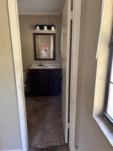 a living room with a fireplace and a rug