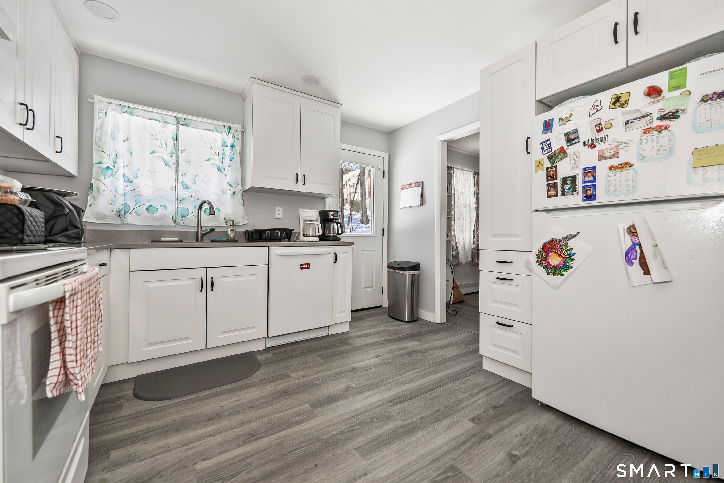 41 Sunnybrook Bend Waterbury, CT 06708 - Photo 11 of 29 a kitchen with stainless steel appliances a stove a sink a refrigerator and cabinets