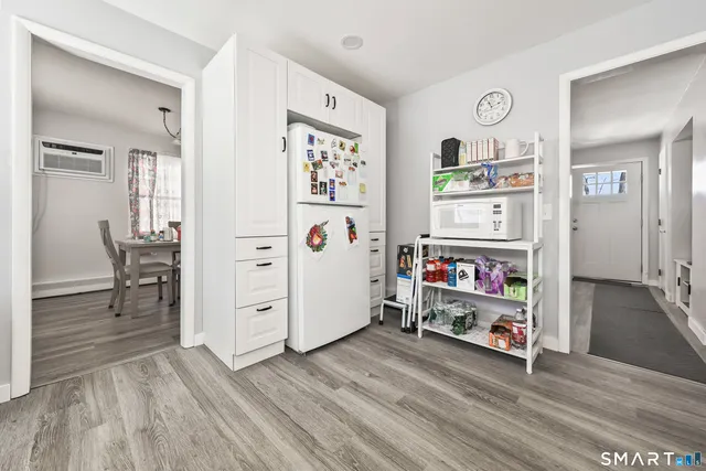 a view of a livingroom with furniture and wooden floor