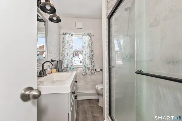 a bathroom with a bathtub and shower