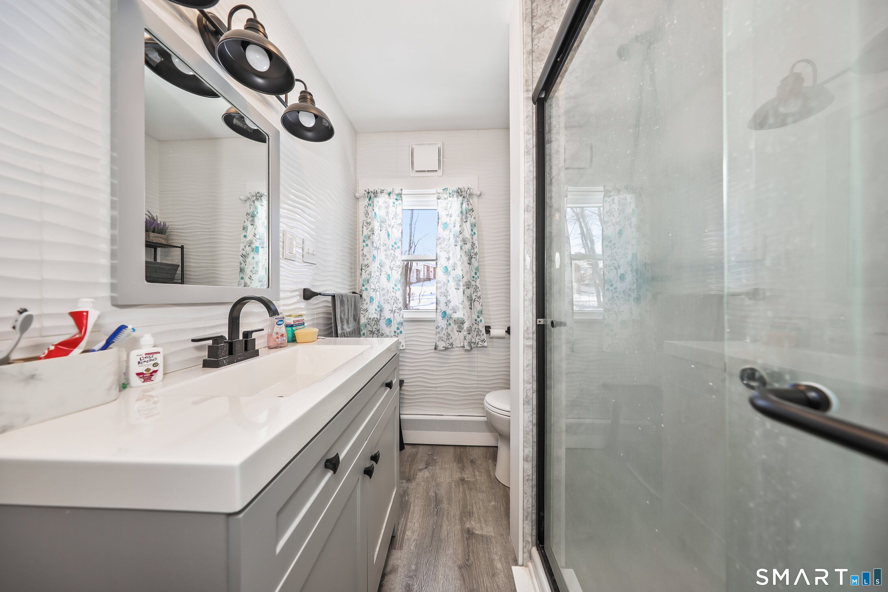 41 Sunnybrook Bend Waterbury, CT 06708 - Photo 16 of 29 a bathroom with a sink a toilet and shower