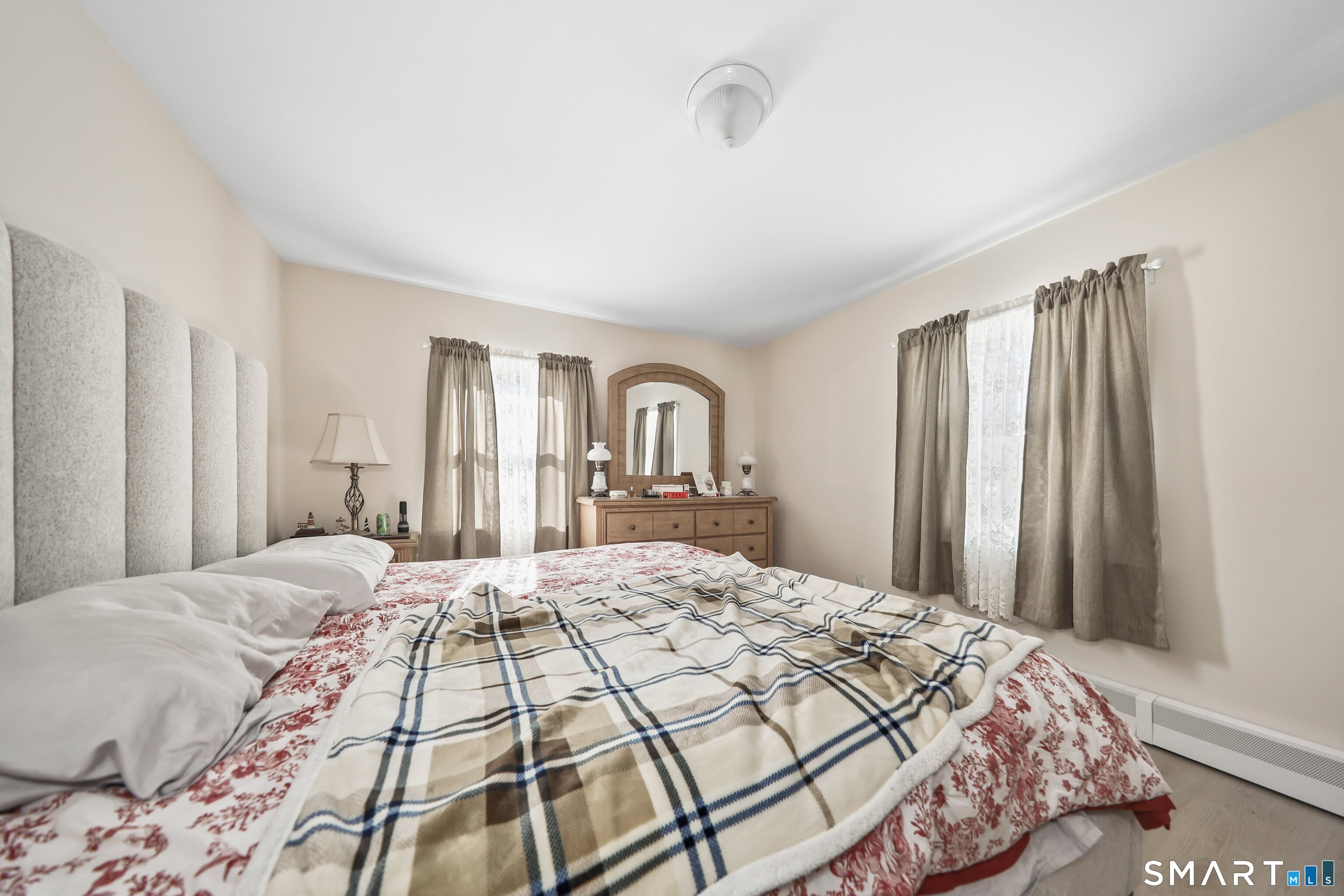 41 Sunnybrook Bend Waterbury, CT 06708 - Photo 17 of 29 a bedroom with a large bed and a window