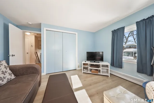 a view of a livingroom with furniture and windows