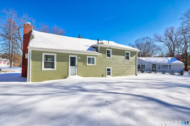 a front view of a house with a garage