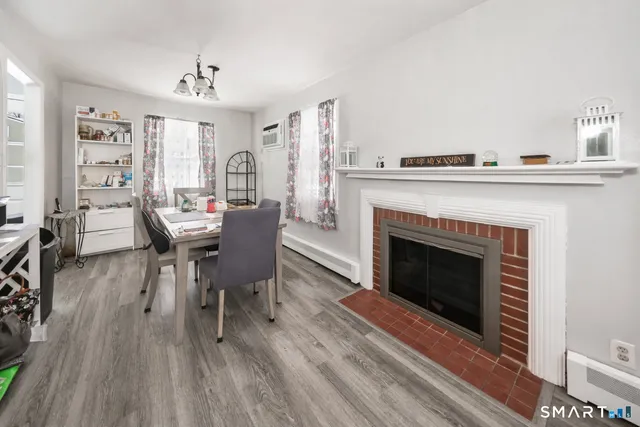 a view of a livingroom with furniture and a fireplace