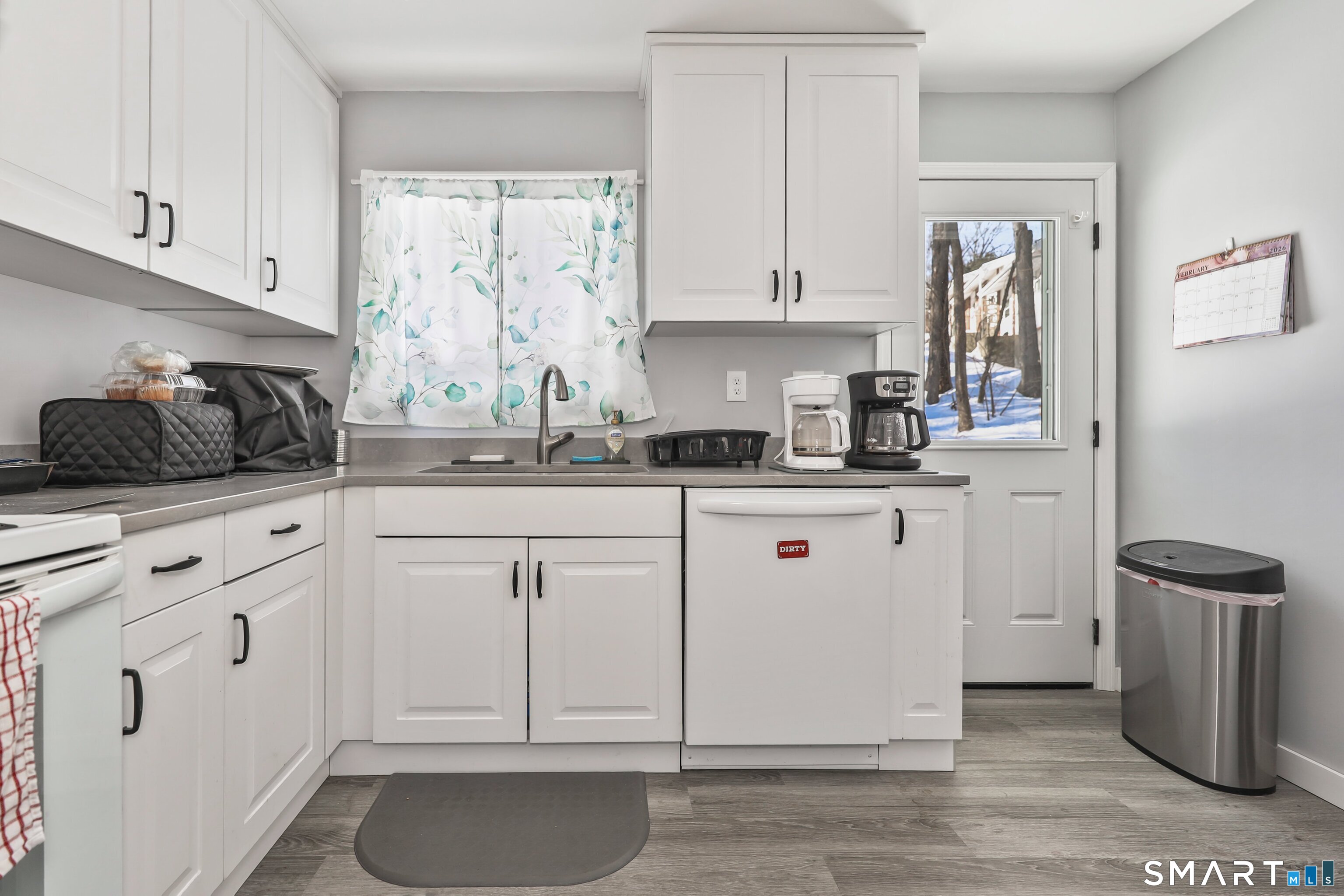 41 Sunnybrook Bend Waterbury, CT 06708 - Photo 10 of 29 a kitchen with white cabinets and white appliances