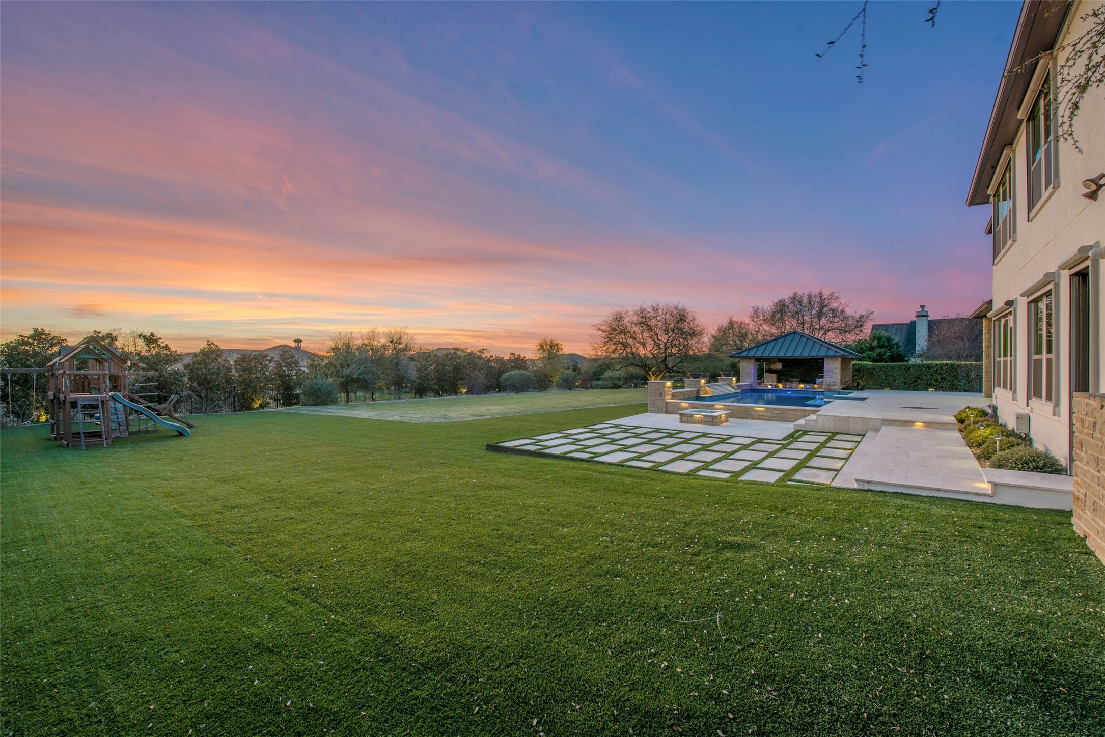 401 Brave Face Street Leander, TX 78641 - Photo 21 of 35 View of turf yard with a patio, an outdoor pool, and a playground
