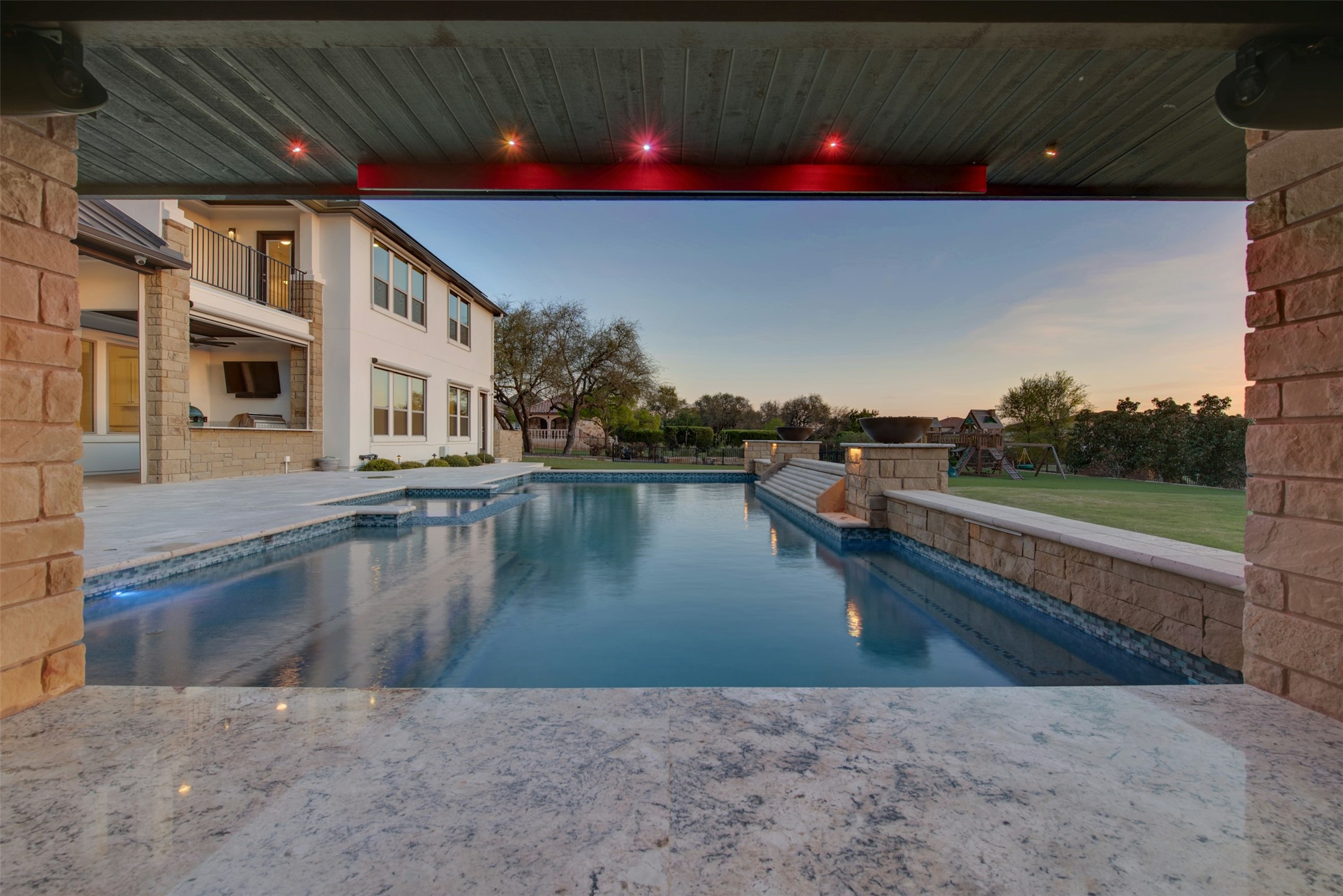 401 Brave Face Street Leander, TX 78641 - Photo 25 of 35 Combined pool / hot tub featuring a patio area and a lawn