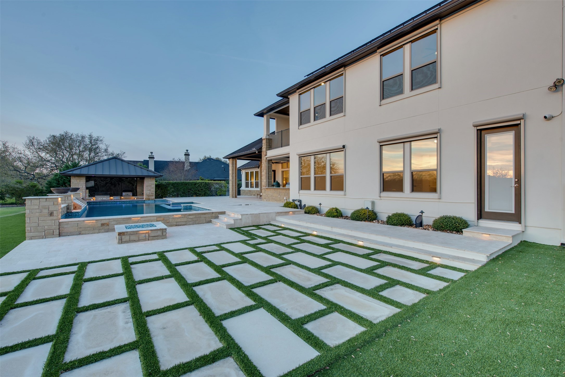 401 Brave Face Street Leander, TX 78641 - Photo 27 of 35 Back of house featuring a patio area, a balcony, and a pool with connected hot tub