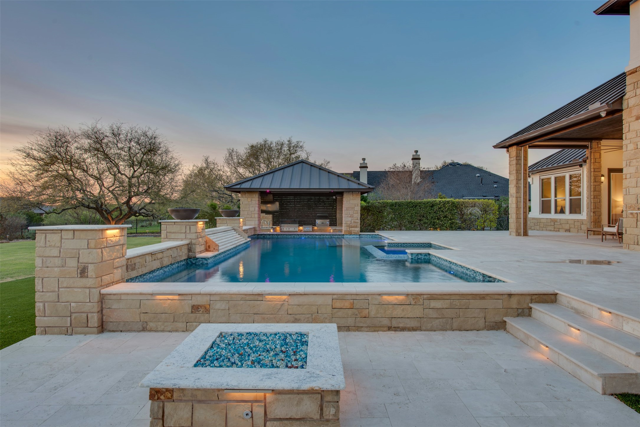 401 Brave Face Street Leander, TX 78641 - Photo 28 of 35 Pool at dusk featuring a patio, a fire pit, a storage structure, an outdoor structure, and a cabana
