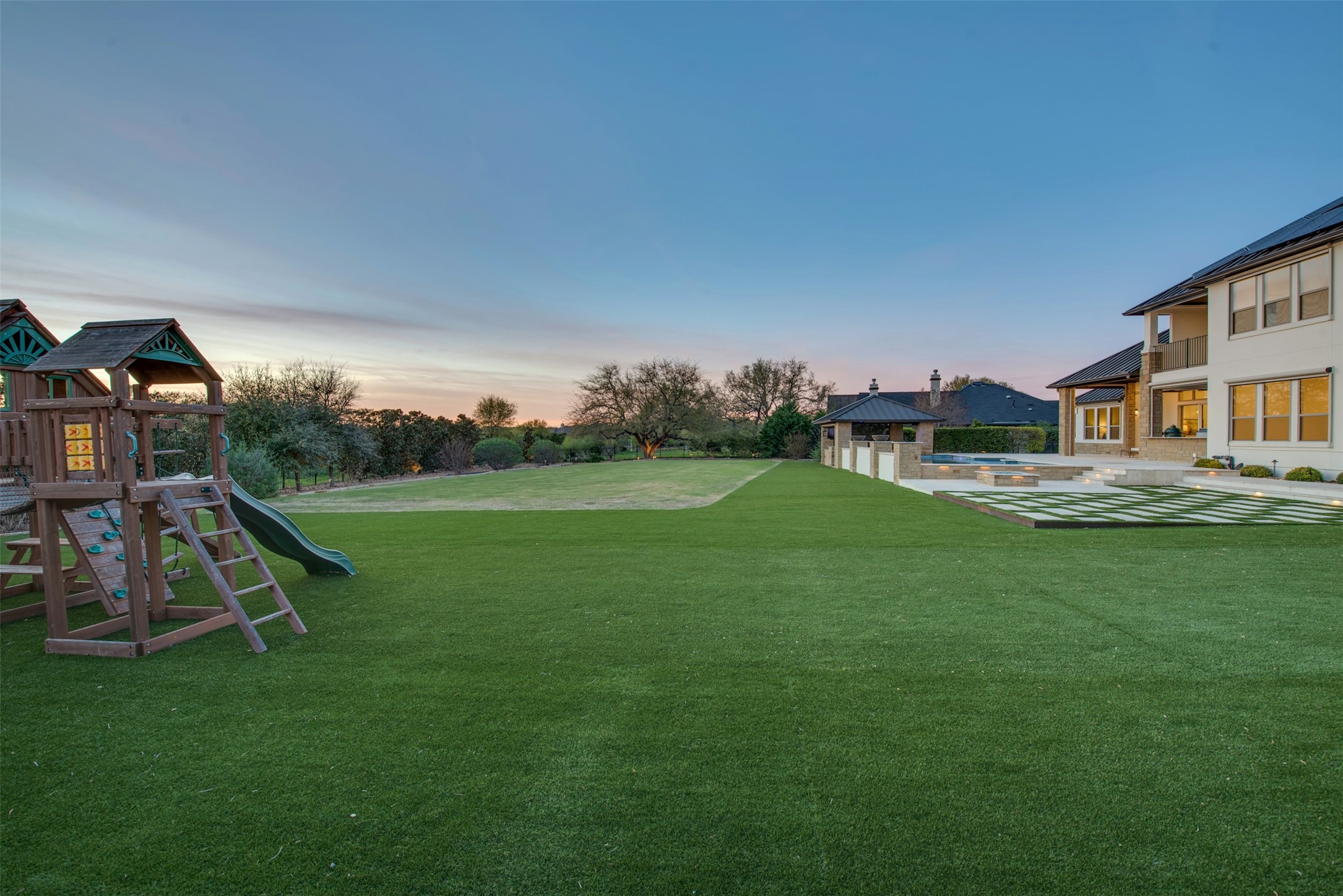 401 Brave Face Street Leander, TX 78641 - Photo 29 of 35 View of turf yard featuring a patio area, an outdoor pool, and a playground