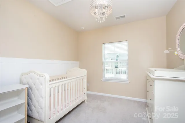 a view of a room with furniture and windows