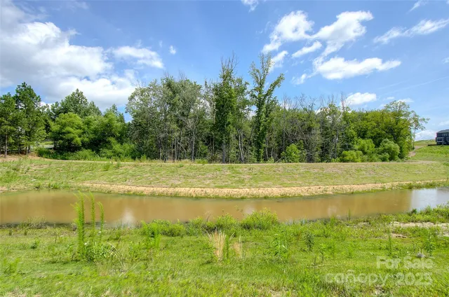 a view of a swimming pool and a yard