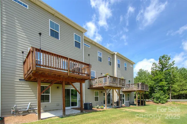 a view of a cafe with a table and chairs under an umbrella