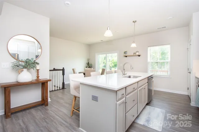 a kitchen with a sink and cabinets