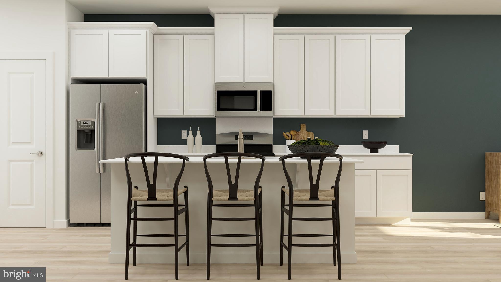 a view of cabinets and chairs with wooden floor