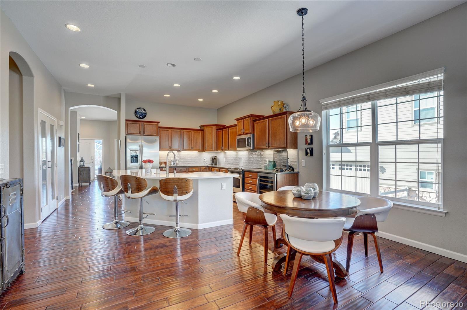 3563 Vestal Loop Broomfield, CO 80023 - Photo 11 of 38 a dining room with furniture and wooden floor