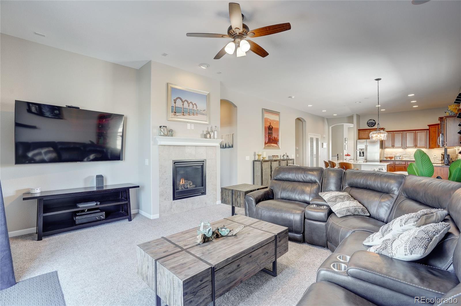 3563 Vestal Loop Broomfield, CO 80023 - Photo 15 of 38 a living room with furniture and a flat screen tv