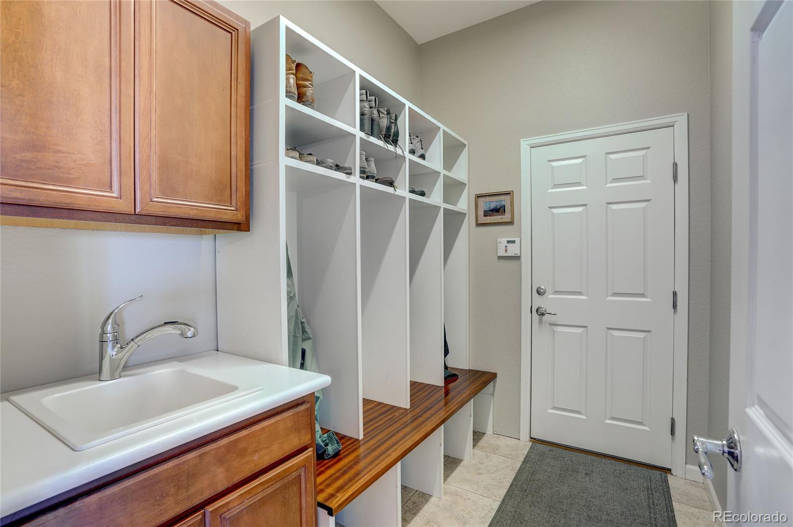3563 Vestal Loop Broomfield, CO 80023 - Photo 22 of 38 a bathroom with a sink and a mirror