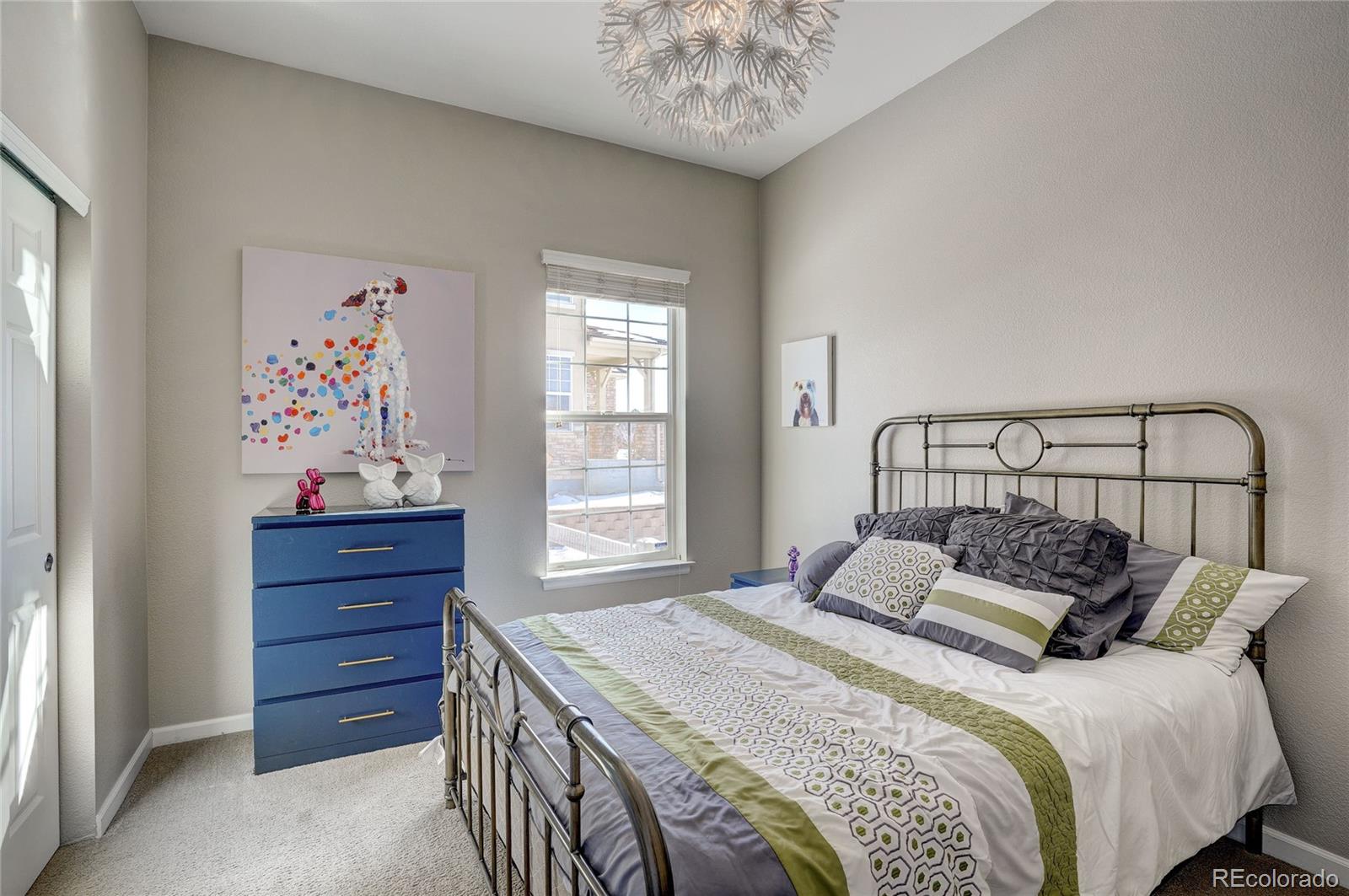 3563 Vestal Loop Broomfield, CO 80023 - Photo 23 of 38 a bedroom with a bed and a window