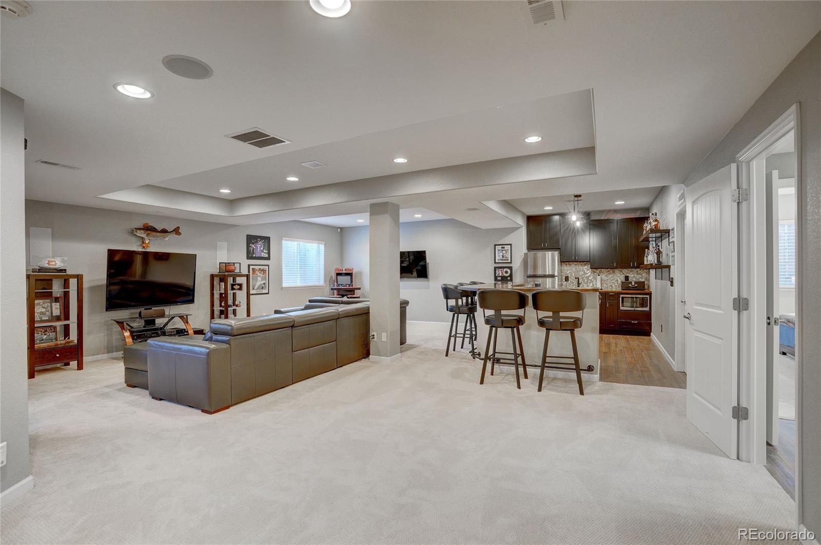 3563 Vestal Loop Broomfield, CO 80023 - Photo 26 of 38 a living room with furniture and a flat screen tv