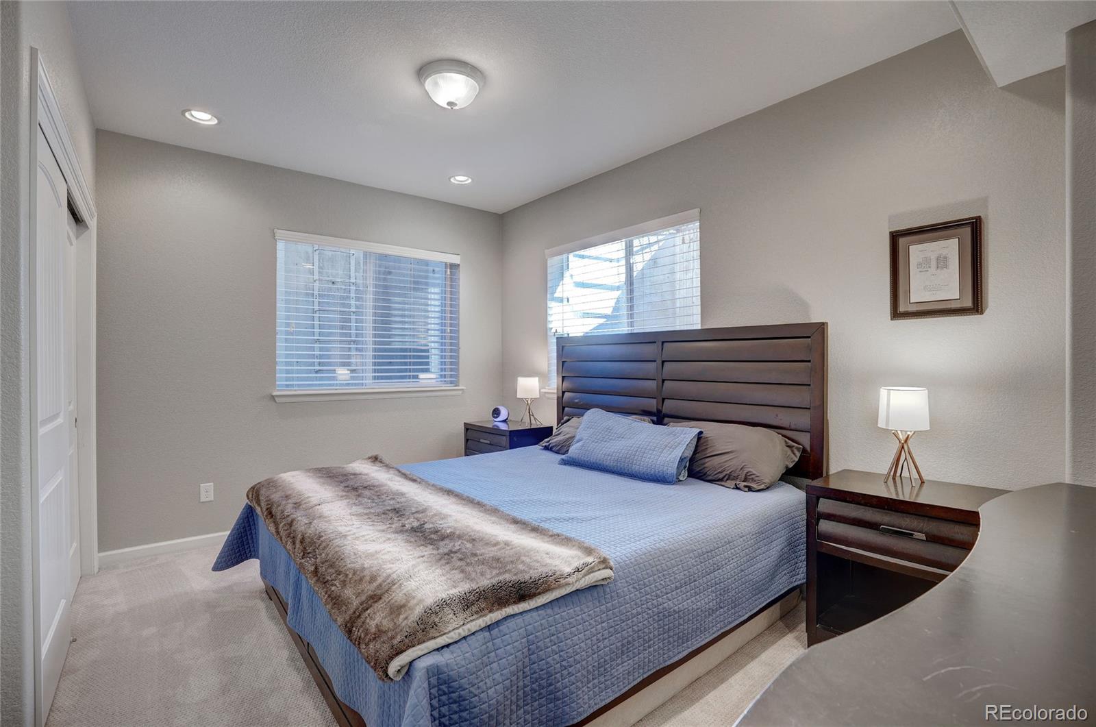 3563 Vestal Loop Broomfield, CO 80023 - Photo 31 of 38 a bedroom with a bed and two windows