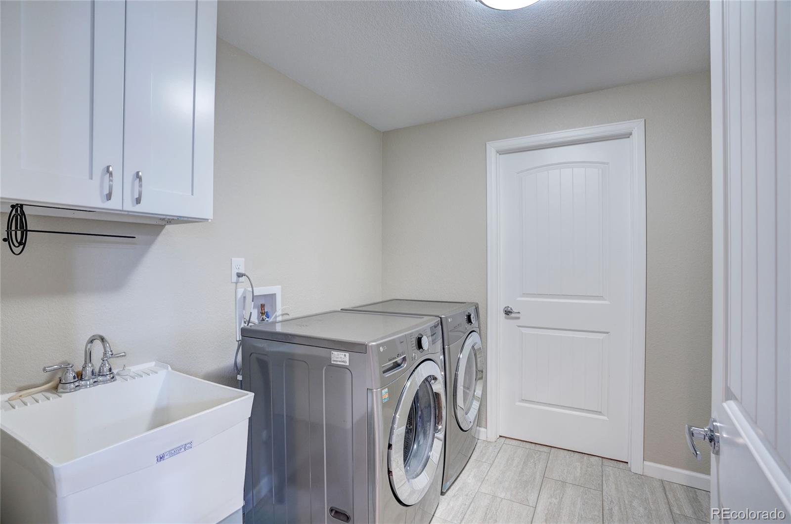 3563 Vestal Loop Broomfield, CO 80023 - Photo 36 of 38 a utility room with dryer and washer