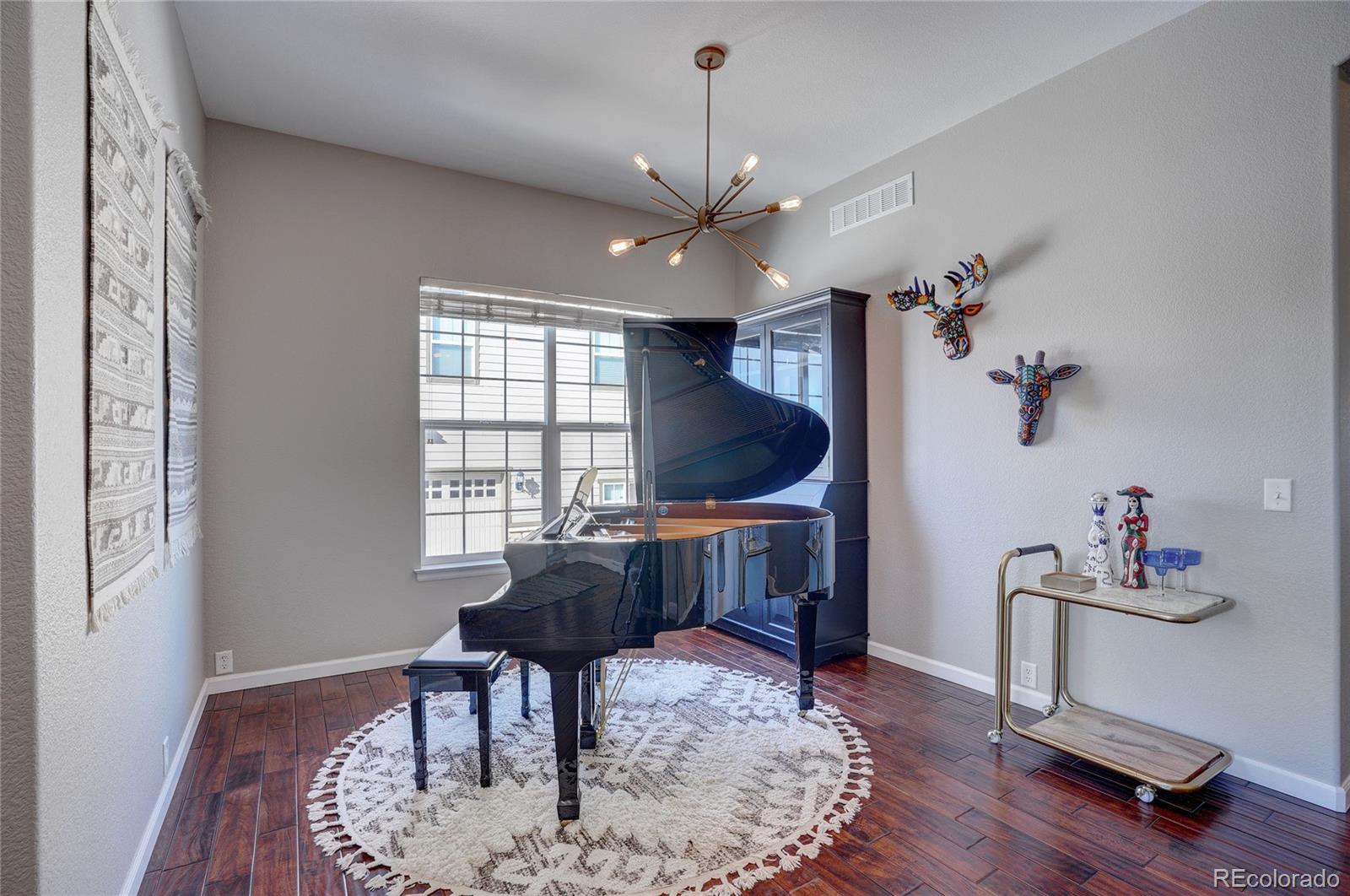 3563 Vestal Loop Broomfield, CO 80023 - Photo 4 of 38 a living room with furniture and a window