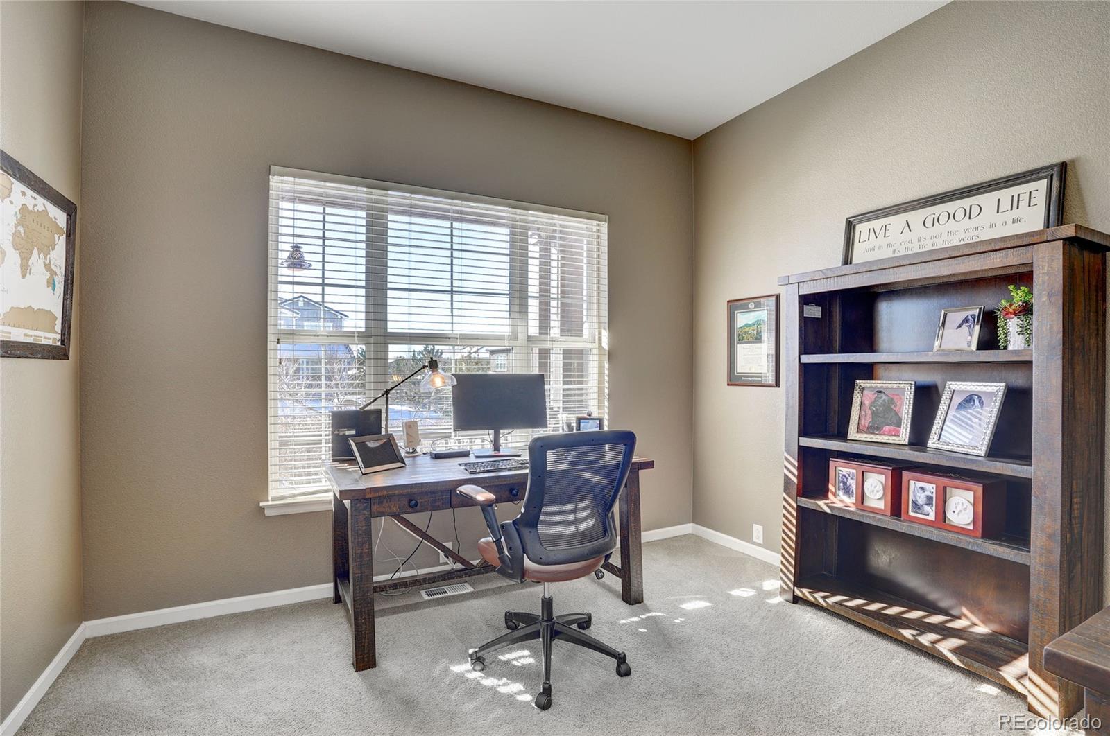 3563 Vestal Loop Broomfield, CO 80023 - Photo 5 of 38 a view of a workspace with furniture and a window