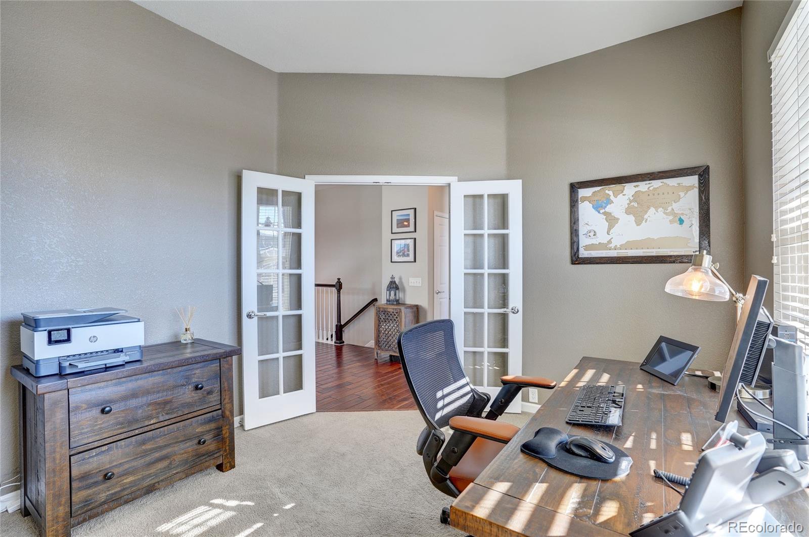 3563 Vestal Loop Broomfield, CO 80023 - Photo 6 of 38 a workspace with furniture and wooden floor