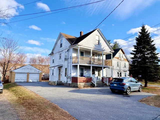a car parked in front of a house