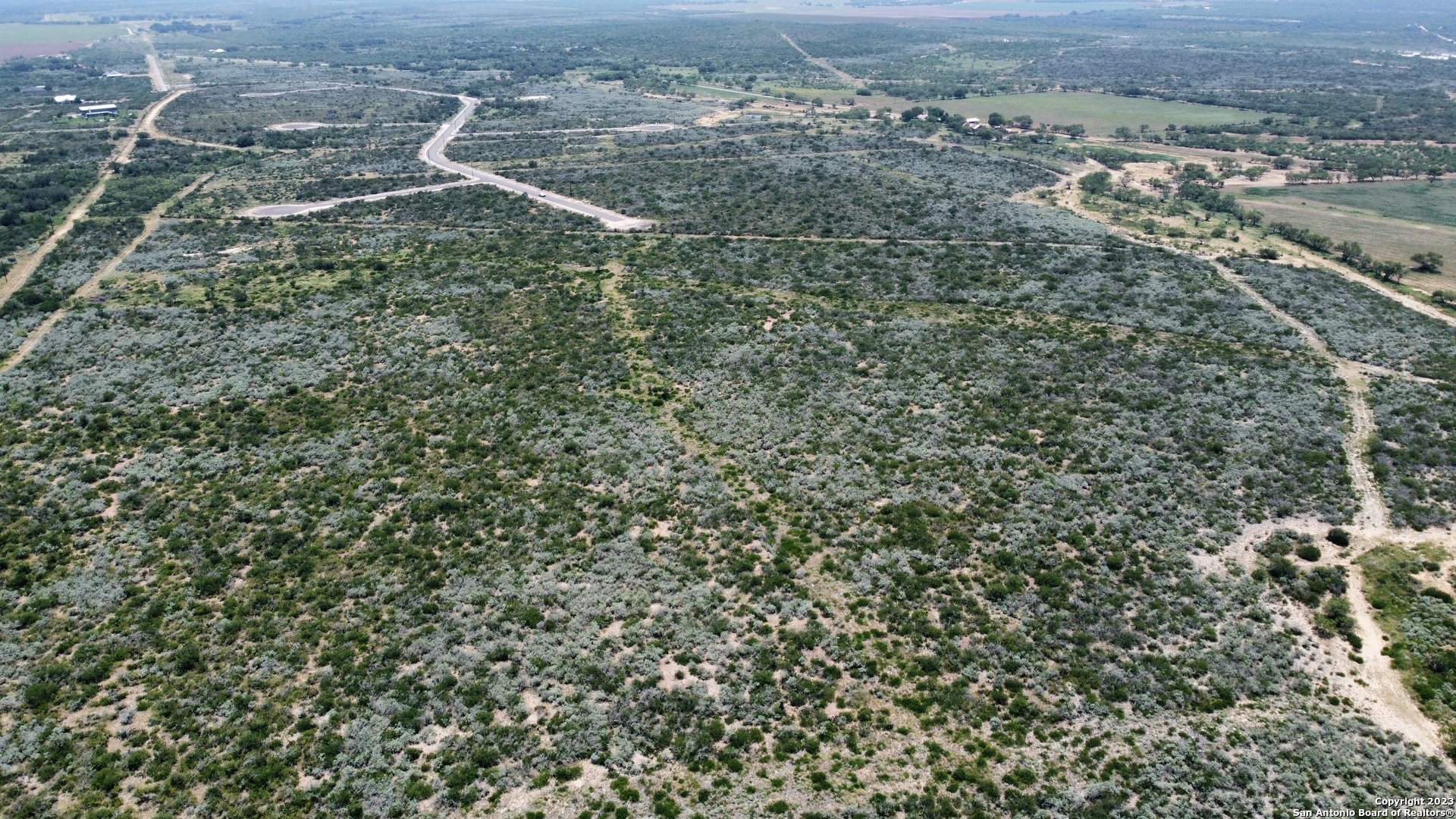 675 Legend Hills Uvalde, TX 78801 - Photo 11 of 14 an aerial view of house with yard and mountain view in back
