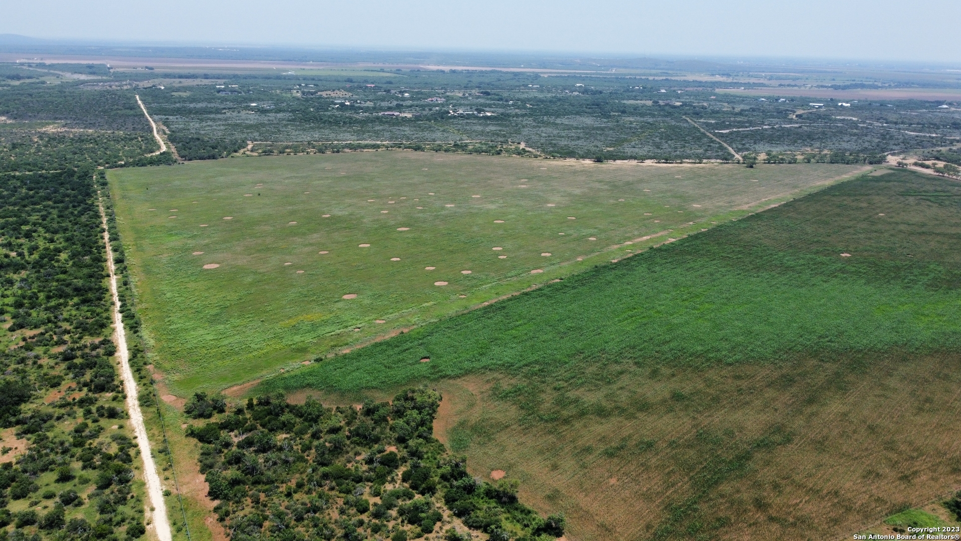 675 Legend Hills Uvalde, TX 78801 - Photo 14 of 14 a view of a lake with a city