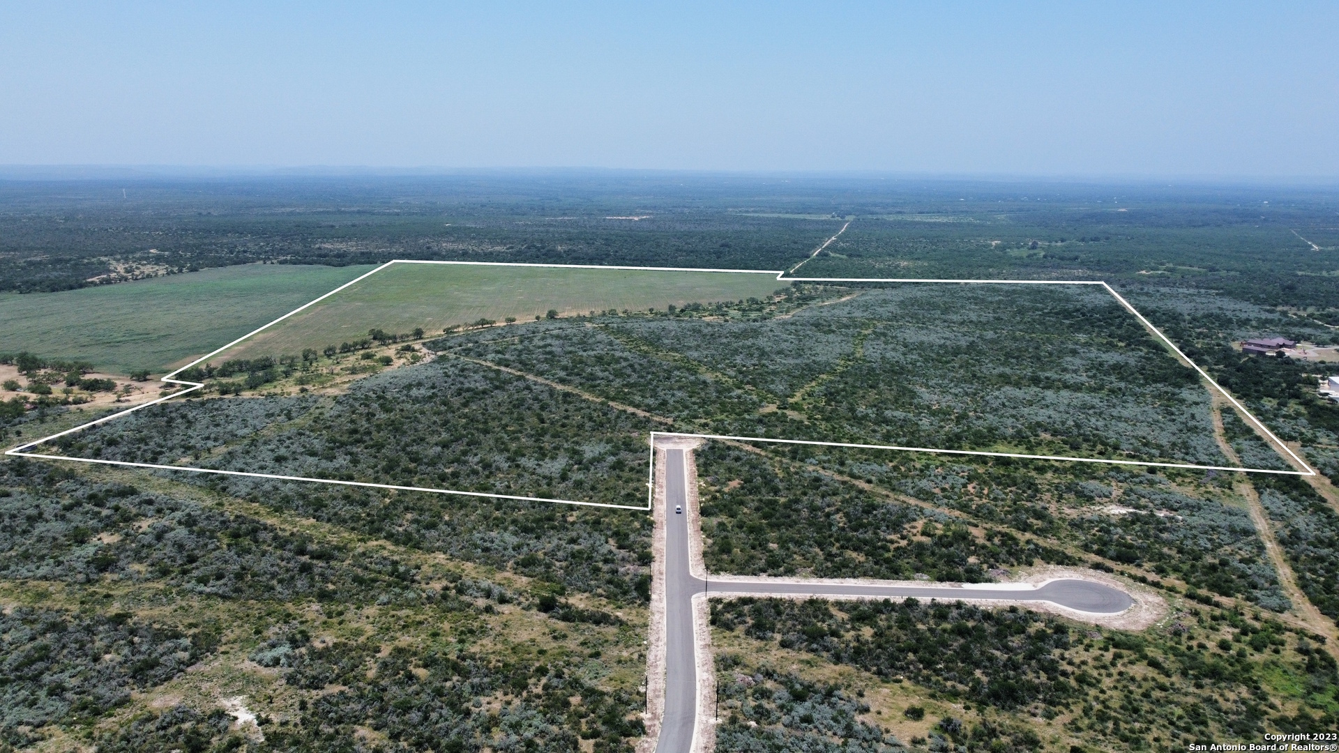 675 Legend Hills Uvalde, TX 78801 - Photo 4 of 14 a view of a yard with wooden fence