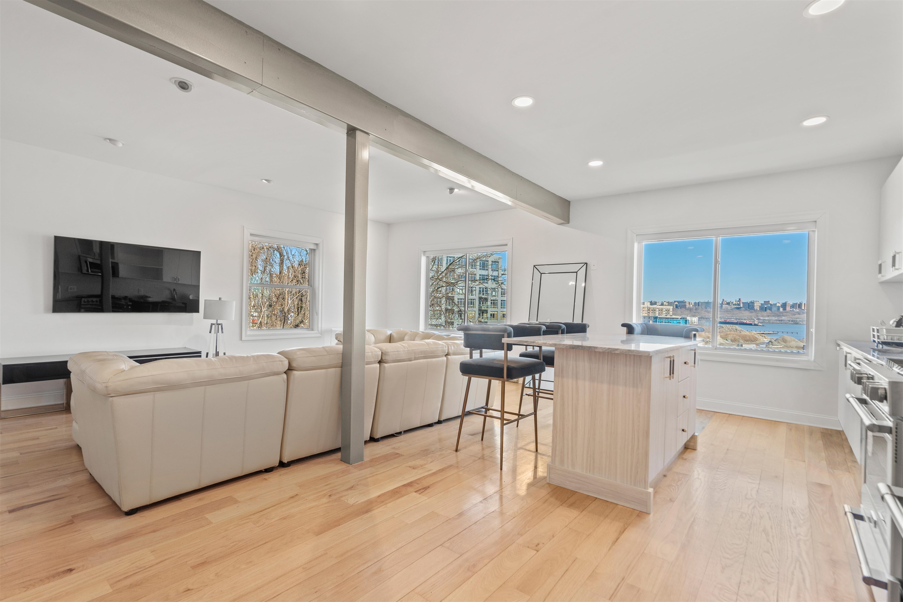 9009 Riverside Place, Unit 3 North Bergen, NJ 07047 - Photo 15 of 18 a living room with furniture and a flat screen tv