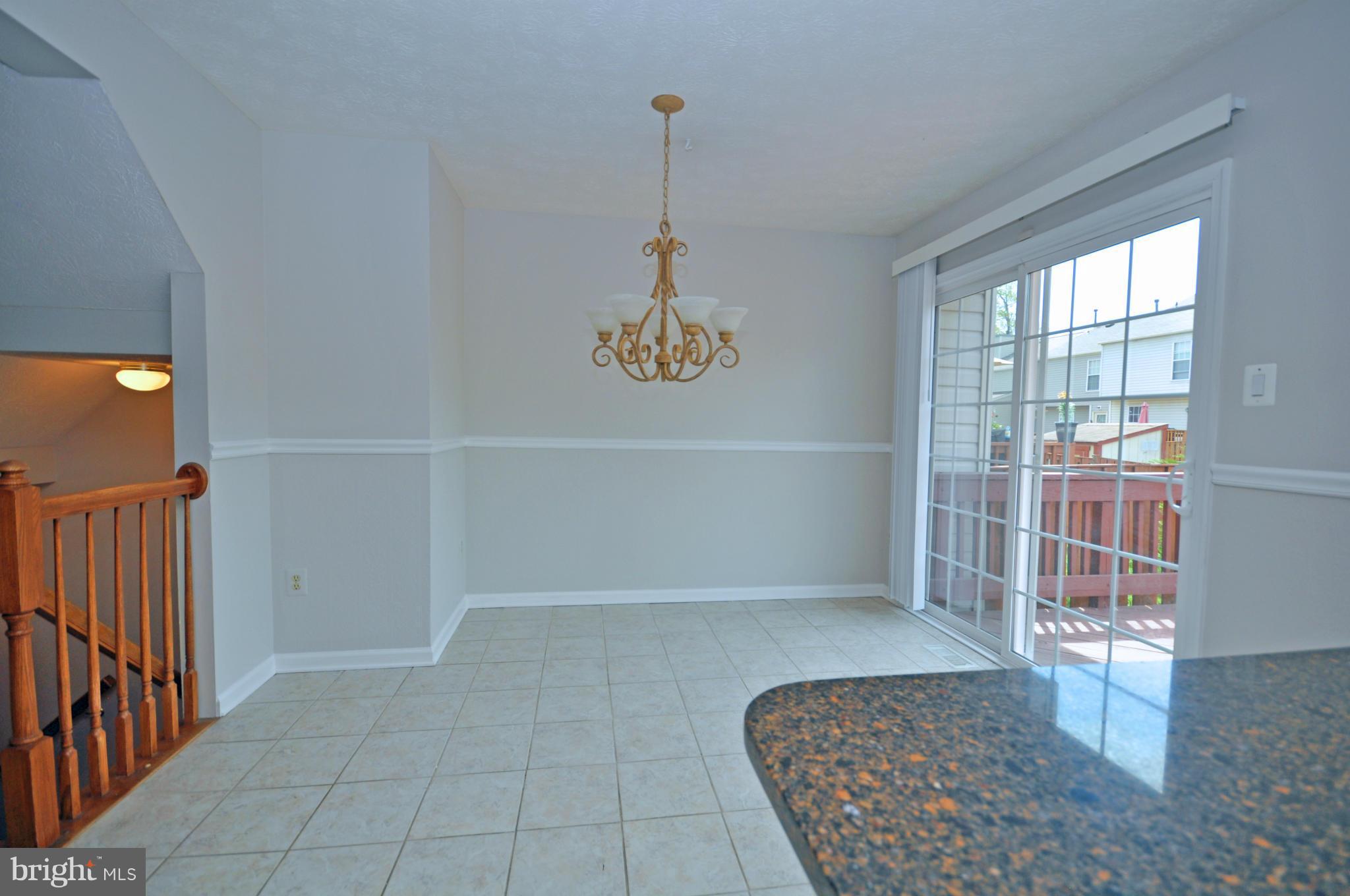 5413 Canonbury Road Baltimore, MD 21237 - Photo 8 of 30 Dining Room with Sliders to Deck